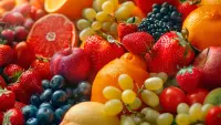 várias frutas diferentes juntas num cenário bem colorido