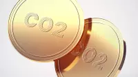 duas moedas de ouro dizendo CO² no meio